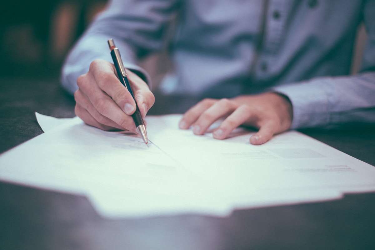 Two conflicting home appraisal reports on a table during a Pennsylvania divorce settlement